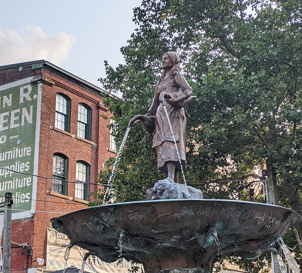 Just outside of Cincinnati, the goose girl statue stands in the middle of Covington, Kentucky's Mainstrasse Village - Things to Do in Cincinnati with Kids