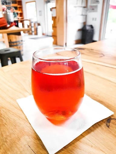 Sampling a glass of apple cider atIsland Orchard Cider is a great date idea when visiting Door County. 