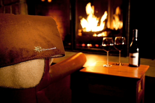 Wine by the fireside at romantic couples getaway Willows Lodge