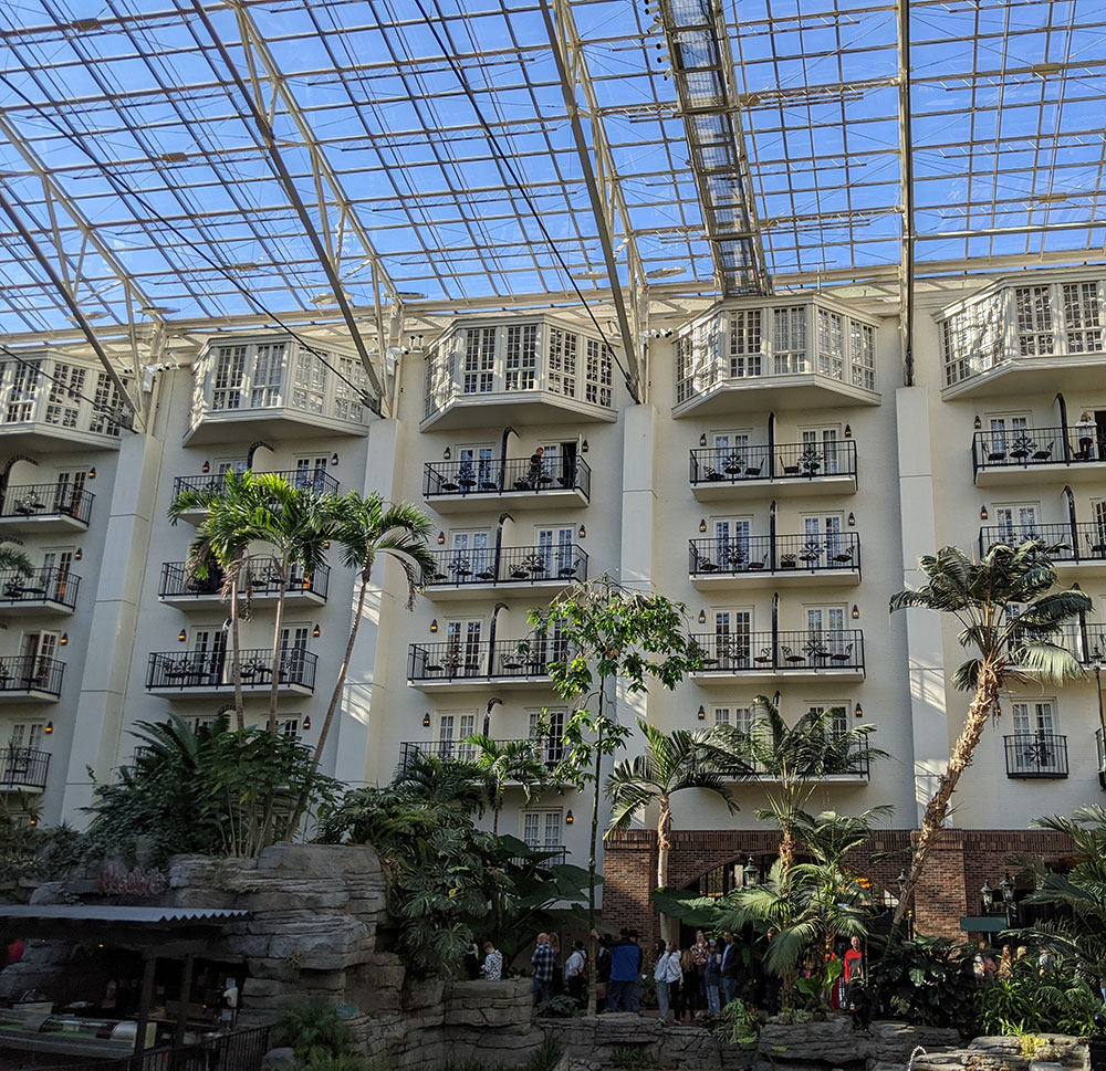 The interior of Gaylord Opryland features atrium gardens, balcony views, live music, shops, and restaurants. 