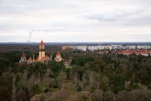 A view of Leipzig with a church in the foreground and more of the city in the distance. A great spot for families to visit.