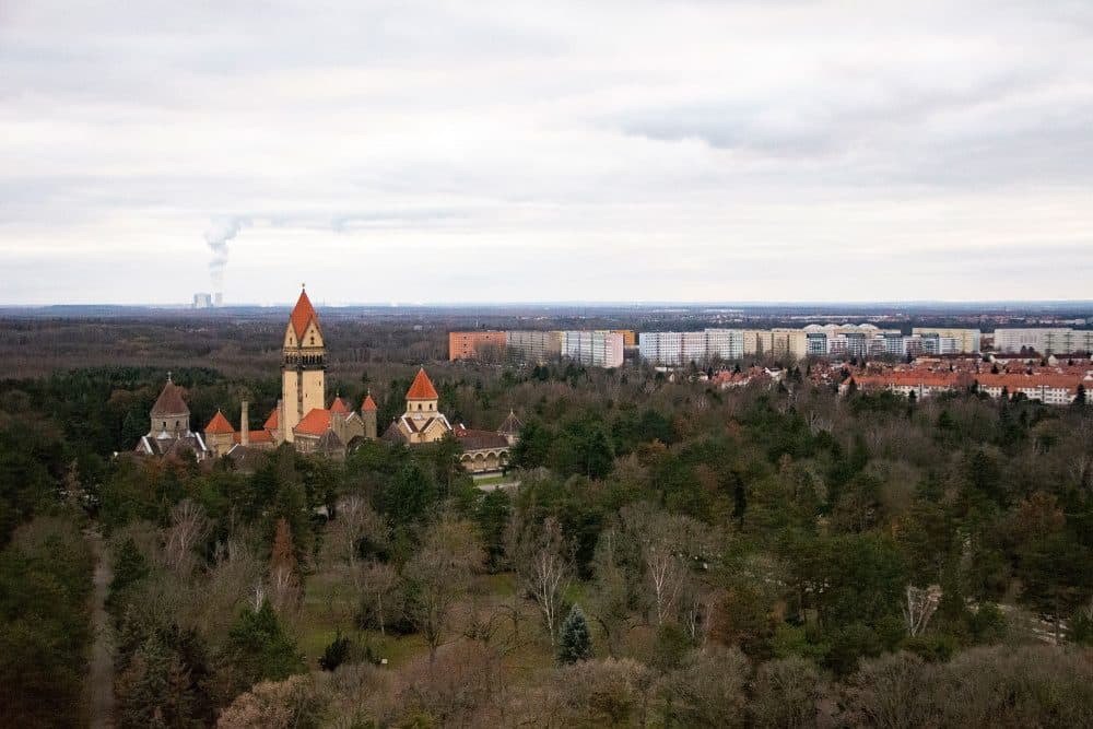 A view of Leipzig with a church in the foreground and more of the city in the distance. A great spot for families to visit.