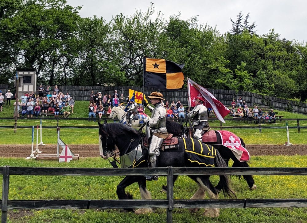 Knights parade with their horses at the Tennessee Renaissance Festival