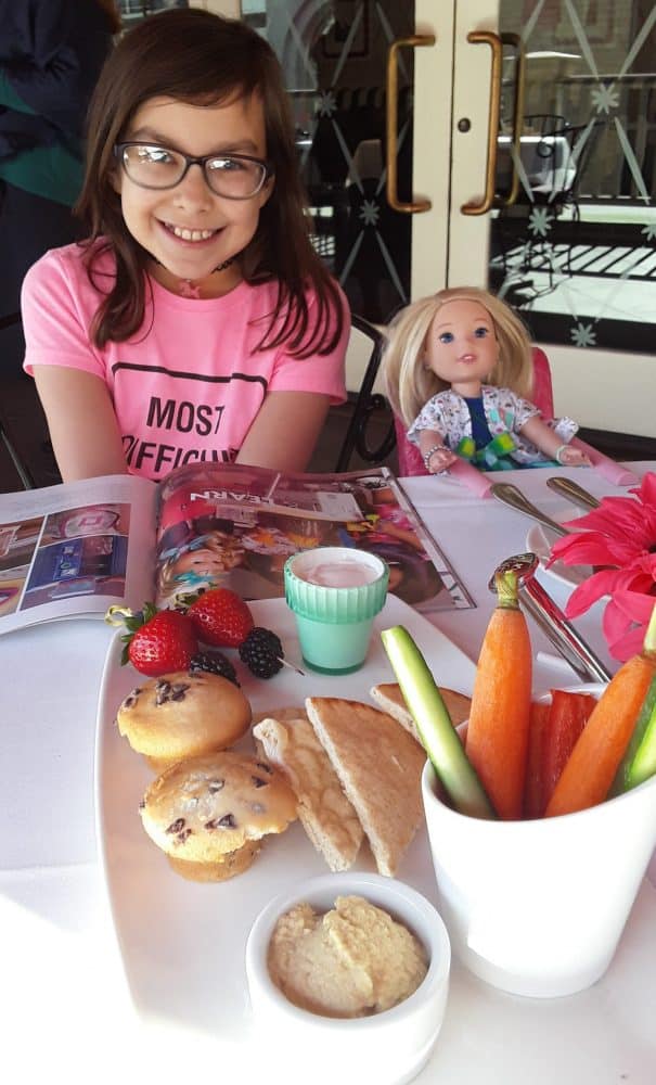 little girl at brunch - Mother's Day Gift Guide