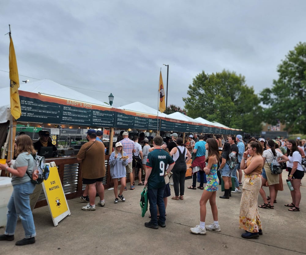 People wait in lines for the food vendors at the Moon River Festival.