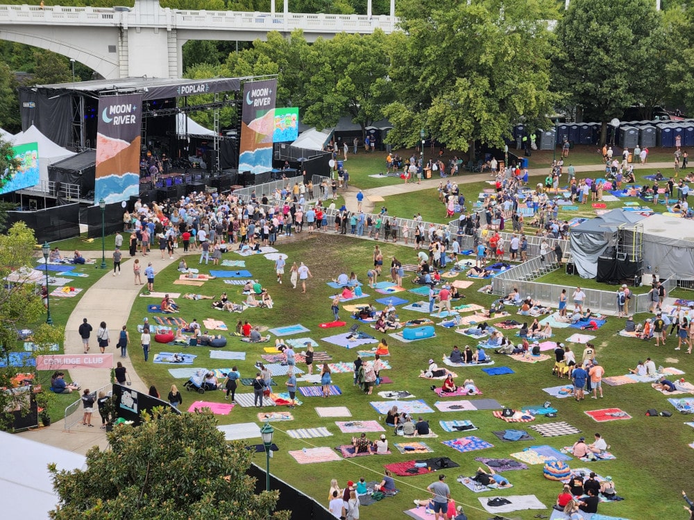 A colorful patchwork of picnic blankets began to cover the ground as families arrived at Moon River Festival in the afternoon.