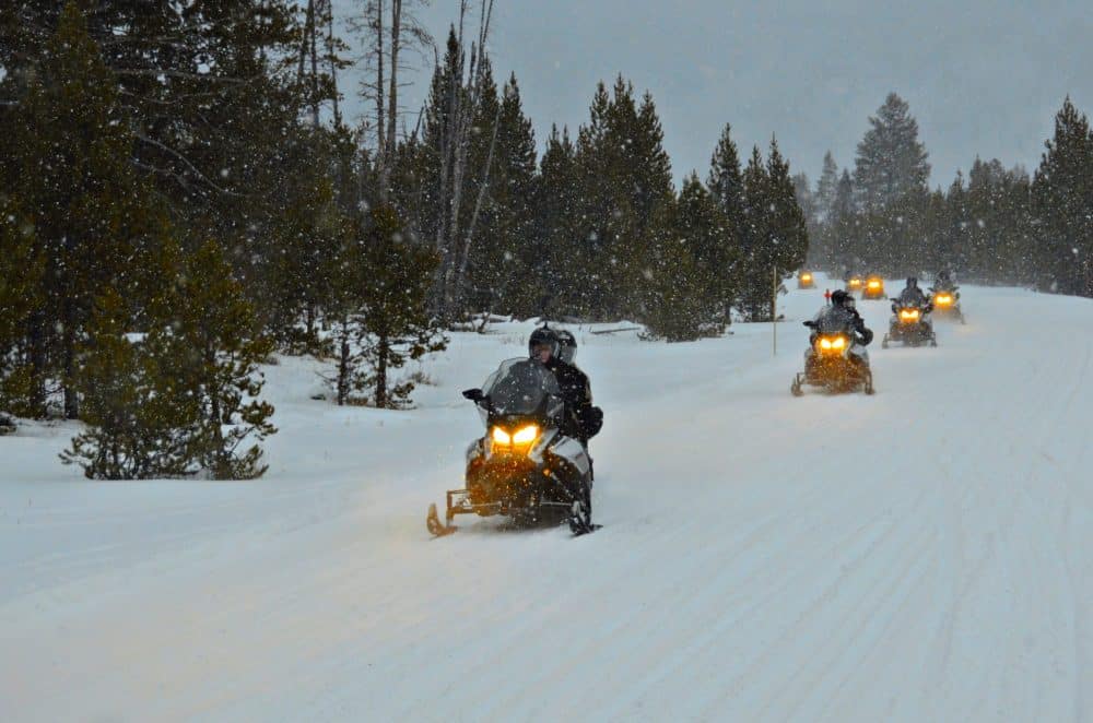 Snowmobile tour during snow fall - Lake Tahoe In December