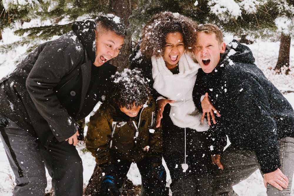 Amazing winter vacations for non-skiers-family having fun in the snow