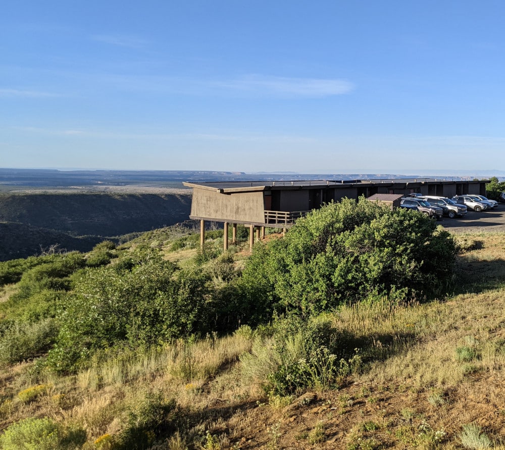A wooden lodge overlooks a valley at Mesa Verde National Park