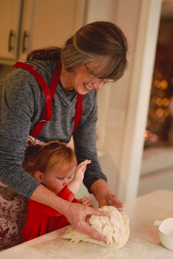 A child with grandmother baking cookies - Christmas family bucket list