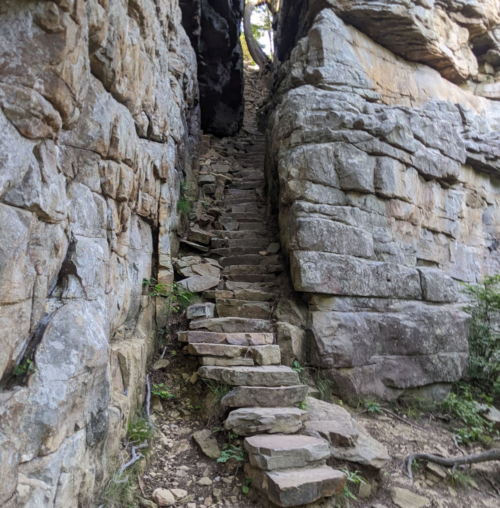 Stone steps extend down through a crack in a stone cliff at Stone Door in Tennessee.