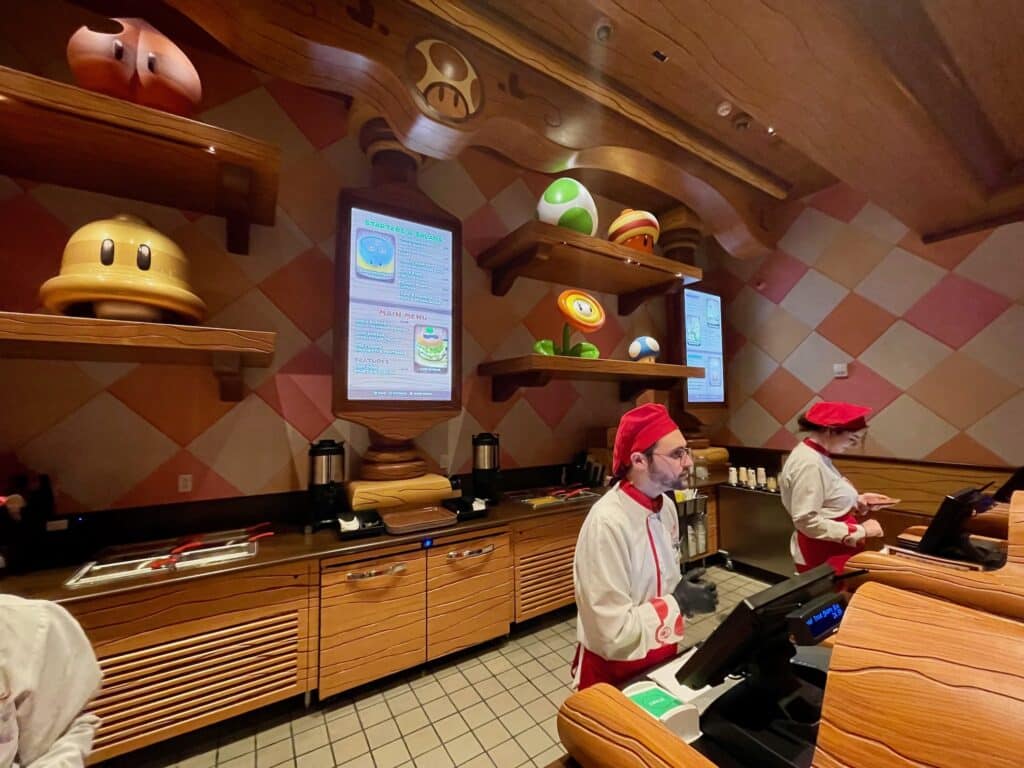 cashiers in toadstool cafe - super nintendo world hollywood