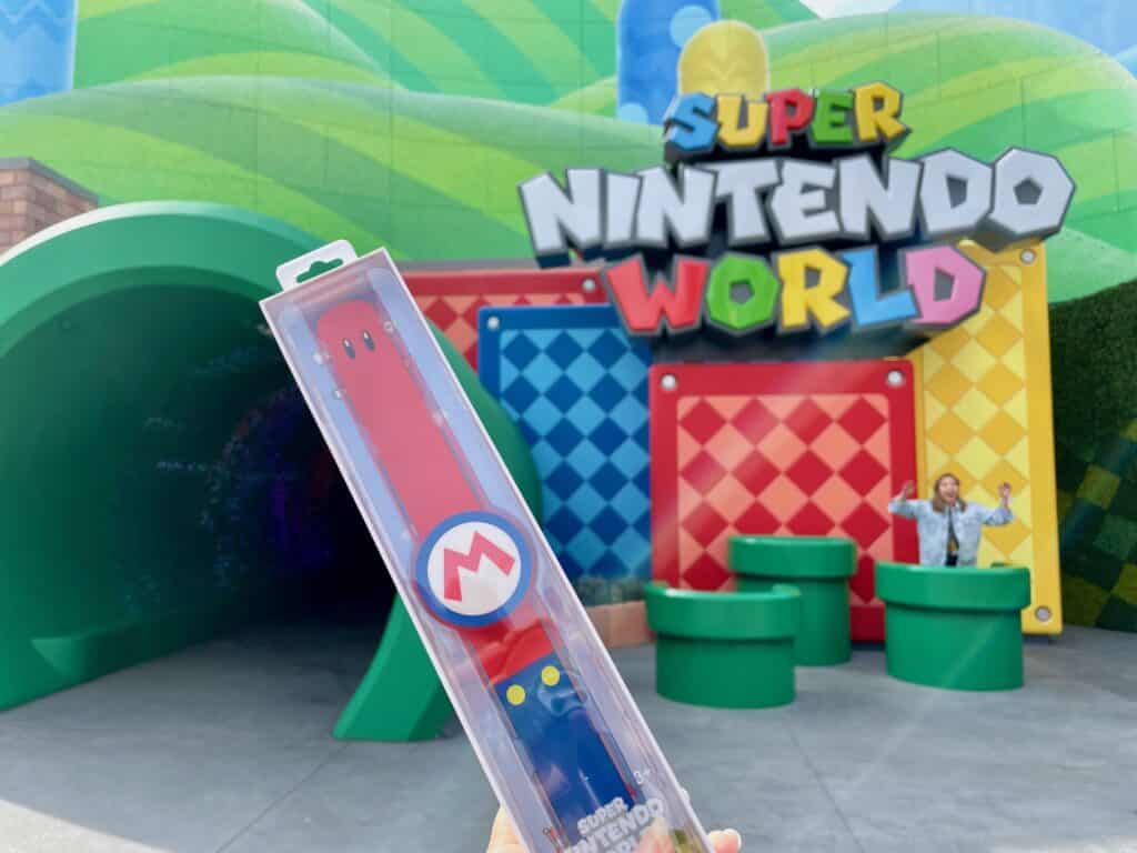 power-up band in package in front of land entrance - super nintendo world hollywood