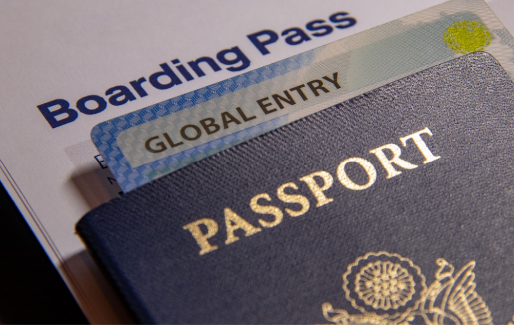 passport book and global entry card - the parking spot