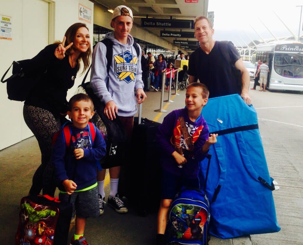 family travel with suitcases - the parking spot