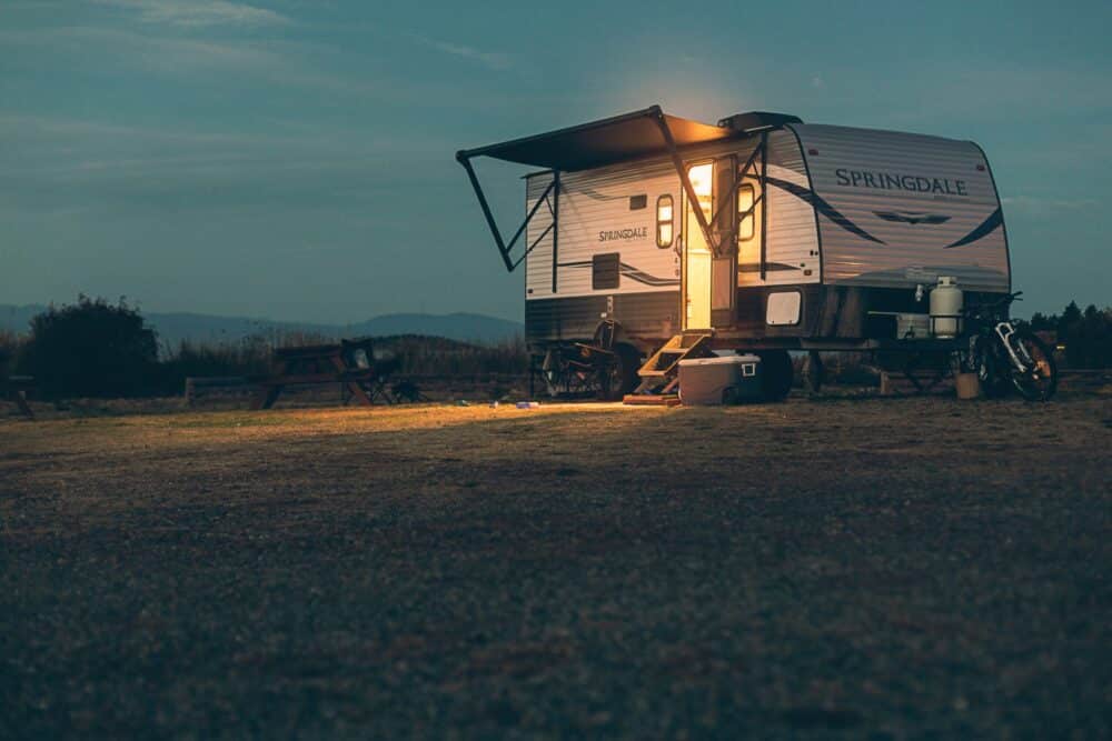 camping trailer at sunset - best small travel trailers for families of four 