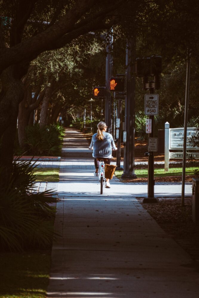 woman on bike: Best Kept Beach Secret of the Soith