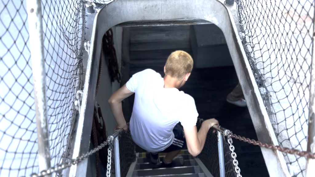 boy going below deck - Tiqets