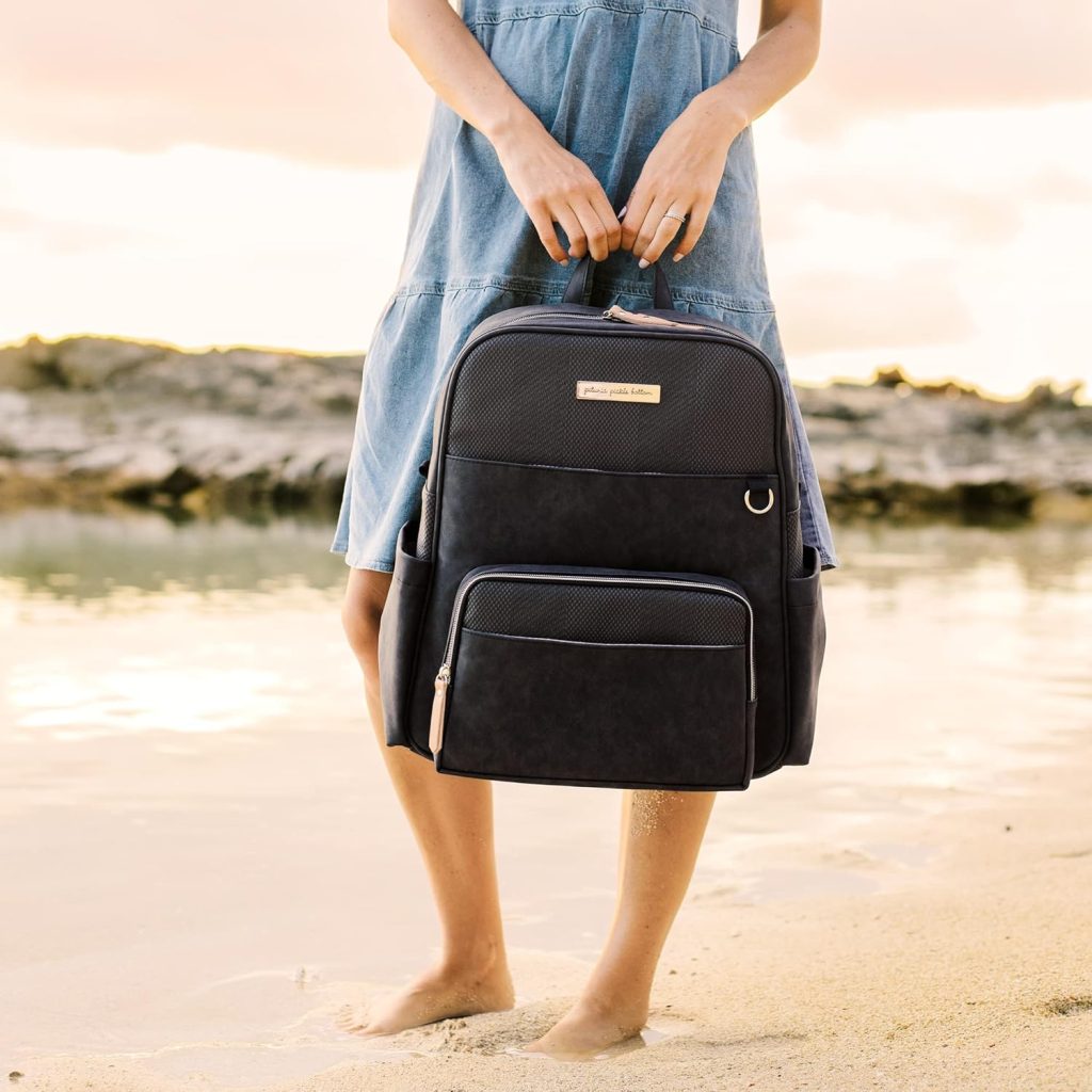 woman holding travel diaper backpack
