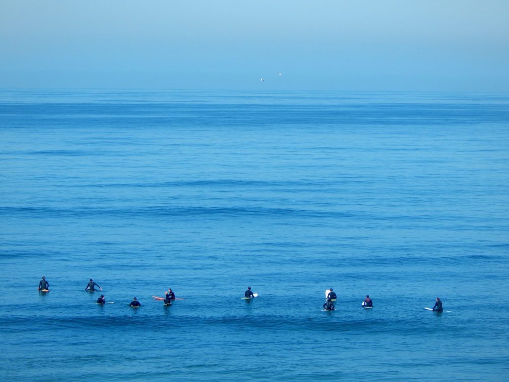 Photo of surfers in the San Diego pacific ocean