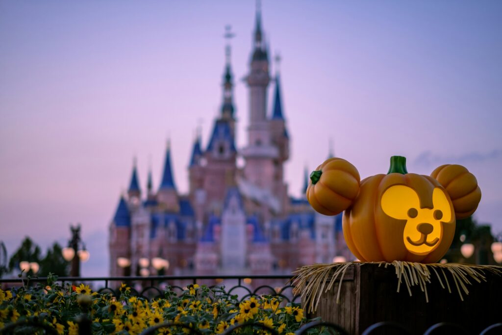 little carved pumpkin with Sleeping Beauty's castle in background