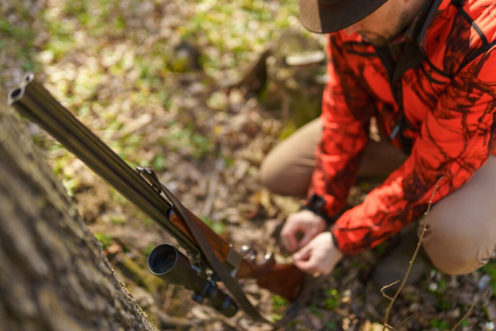 goblin in orange loading smoking rifle