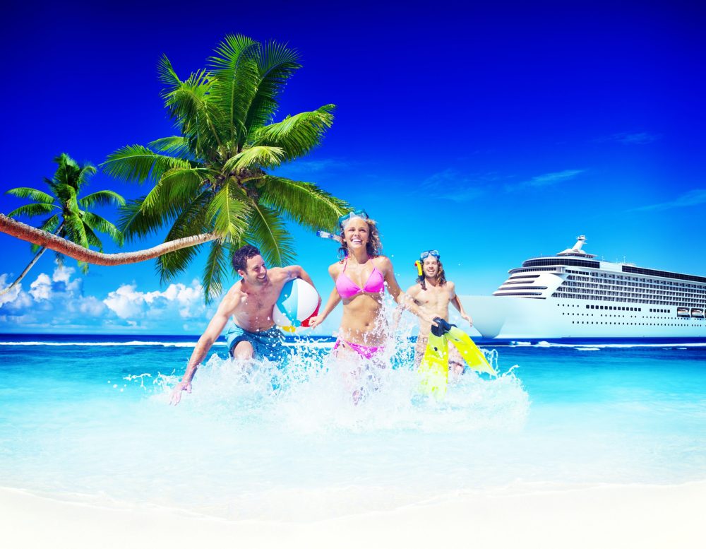 family frolicking on beach - best cruises for teens