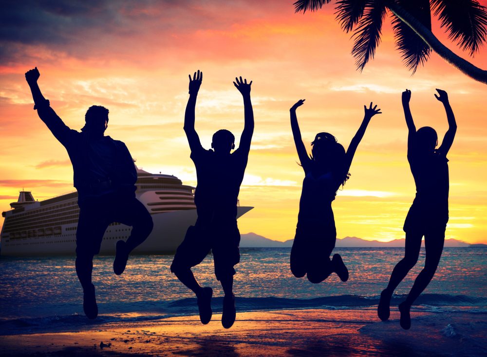 Family silhoutte jumping for joy in front of cruise ship - best cruises for teens