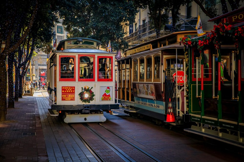 Christmas trolley decorated with a wreath over its one headlight in San Fran