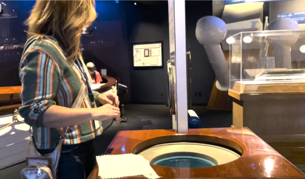 A bucket of water with a woman standing over it - Branson Family Vacations