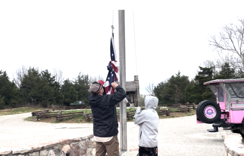 Raising the flag on pole - Branson Family Vacations