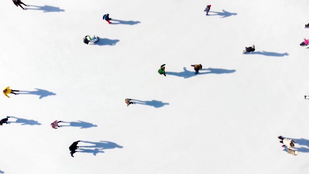 aerial shot of many ice skaters