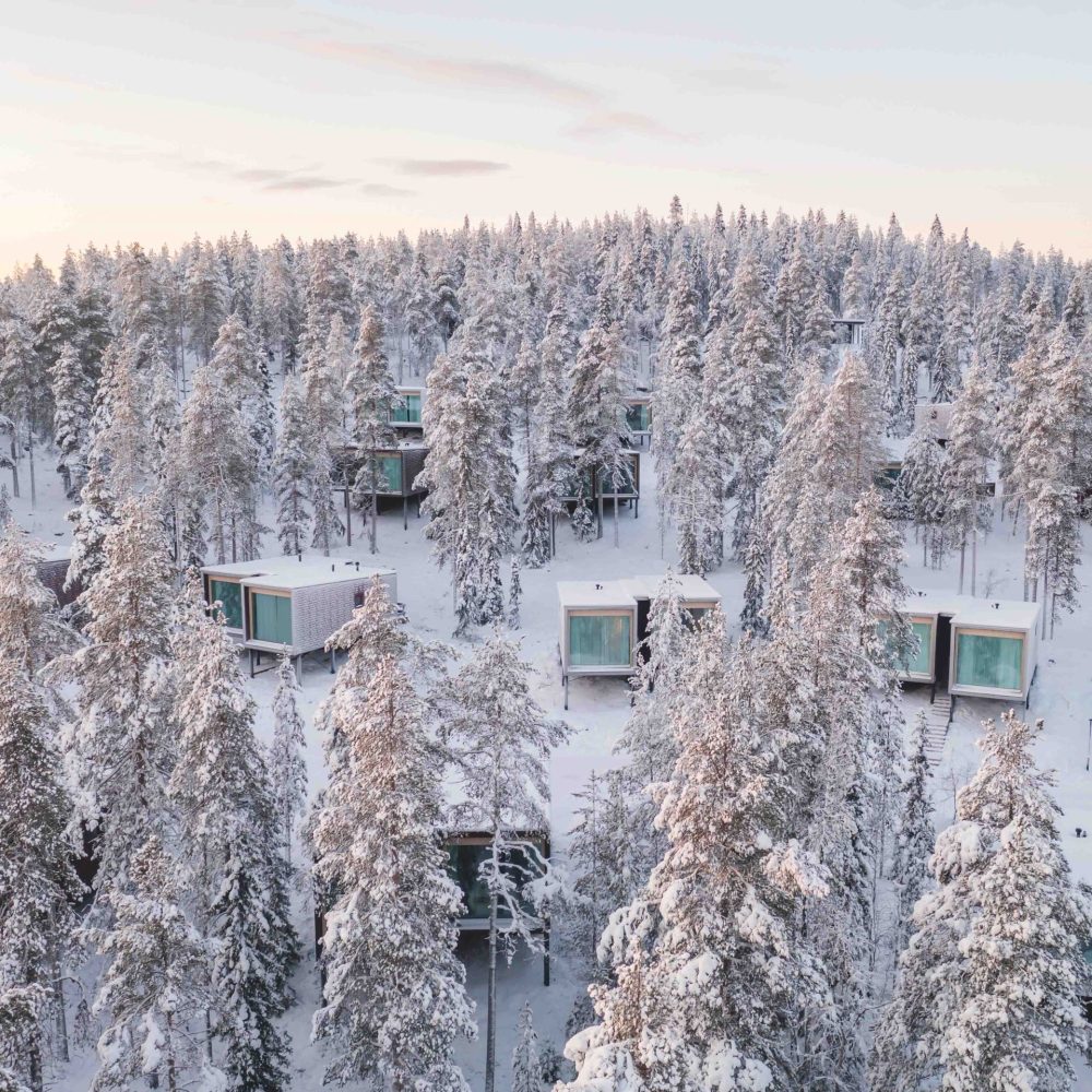 Wintery scene of the arctic treehouse resort