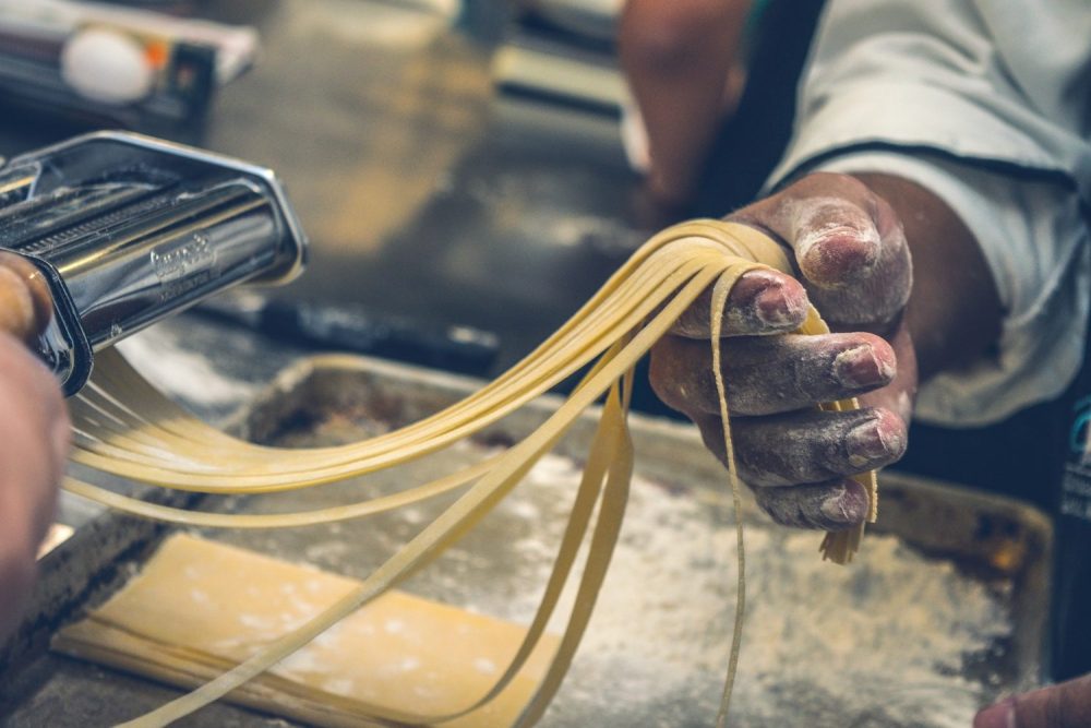 Man making fresh pasta. Family restaurants Las Vegas. 