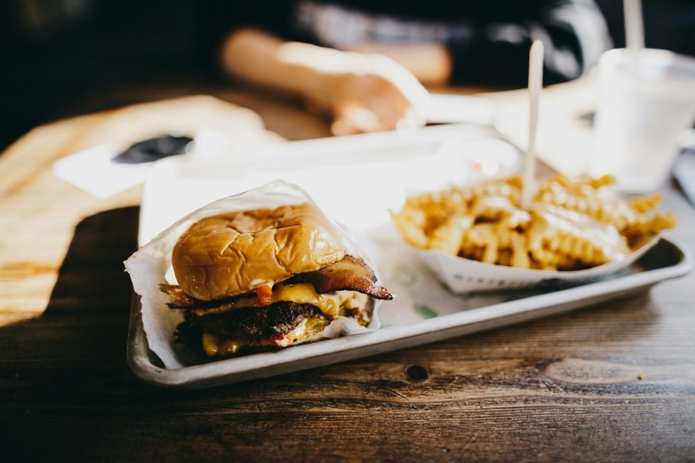 Picture of burger and fries from Shake Shack. Family restaurants Las Vegas.