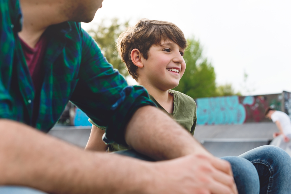 Dad proudly looking at tween son-5 Meaningful Family Volunteer Vacations