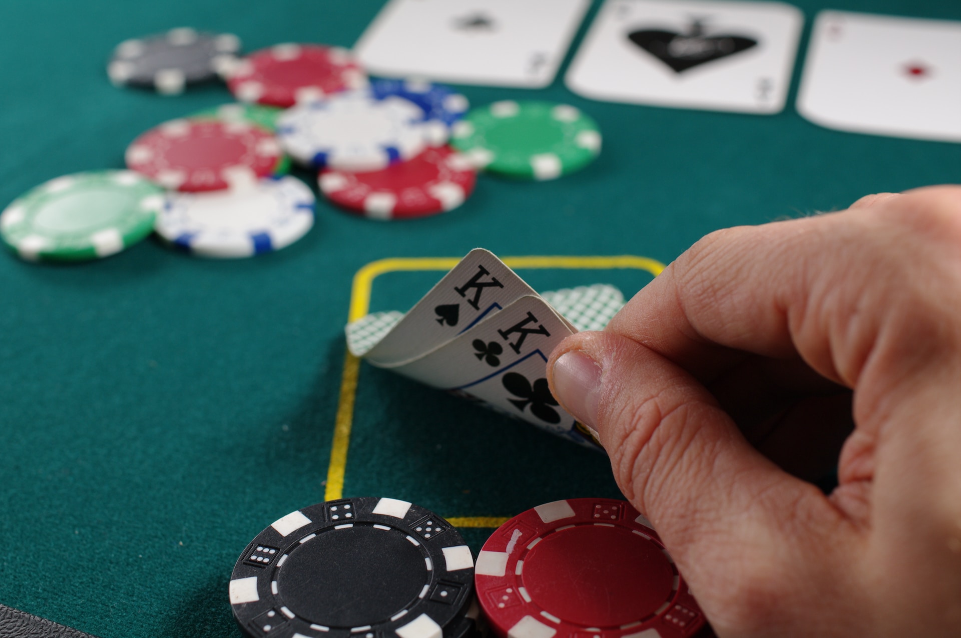 Man with cards and poker chips - Las Vegas family resorts