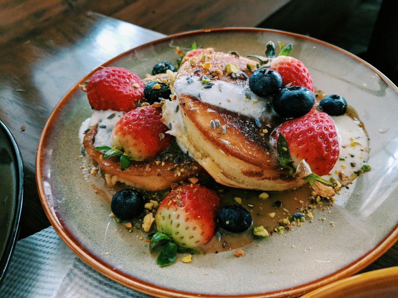 Pancakes topped with fresh berries. Romantic cabins with hot tubs in Virginia. 