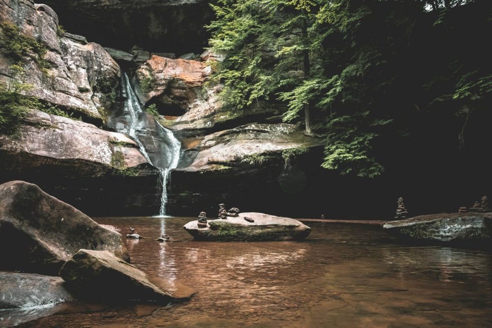 Water fall and rocks in Hocking Hills. Romantic getaways in Ohio with hot tubs.