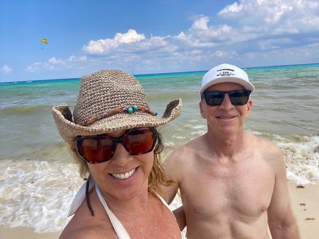 couple in hats on beach