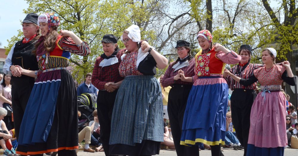 Couples in Dutch costumes lined up - Tulip Time Festival in Holland Michigan