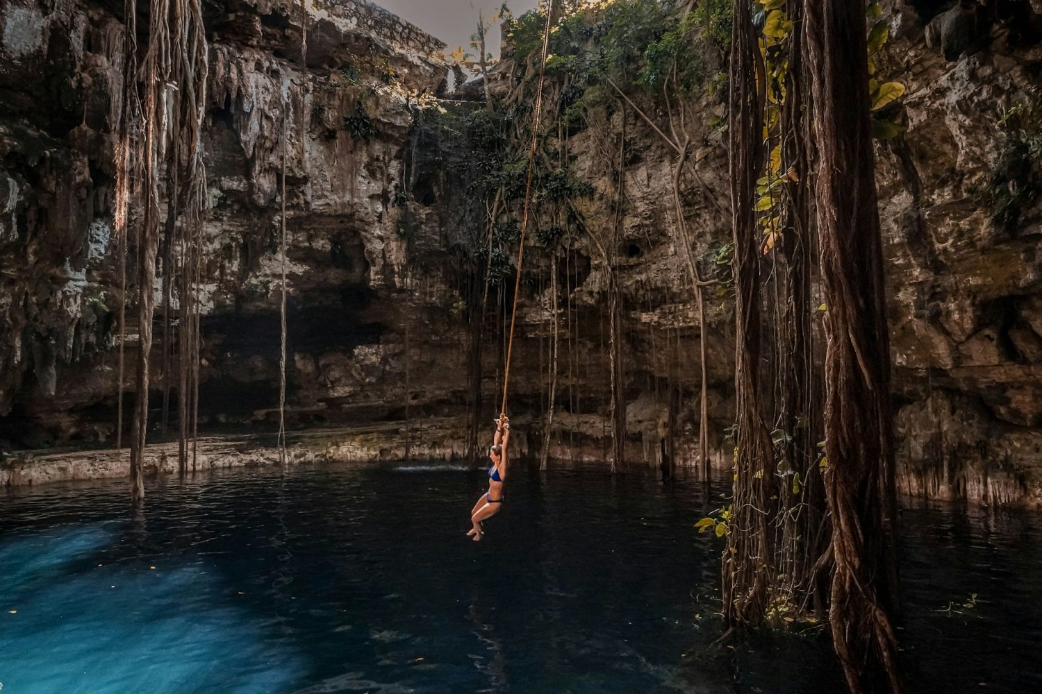 Teen jumping into cenote. Best all-inclusive resorts for teens.