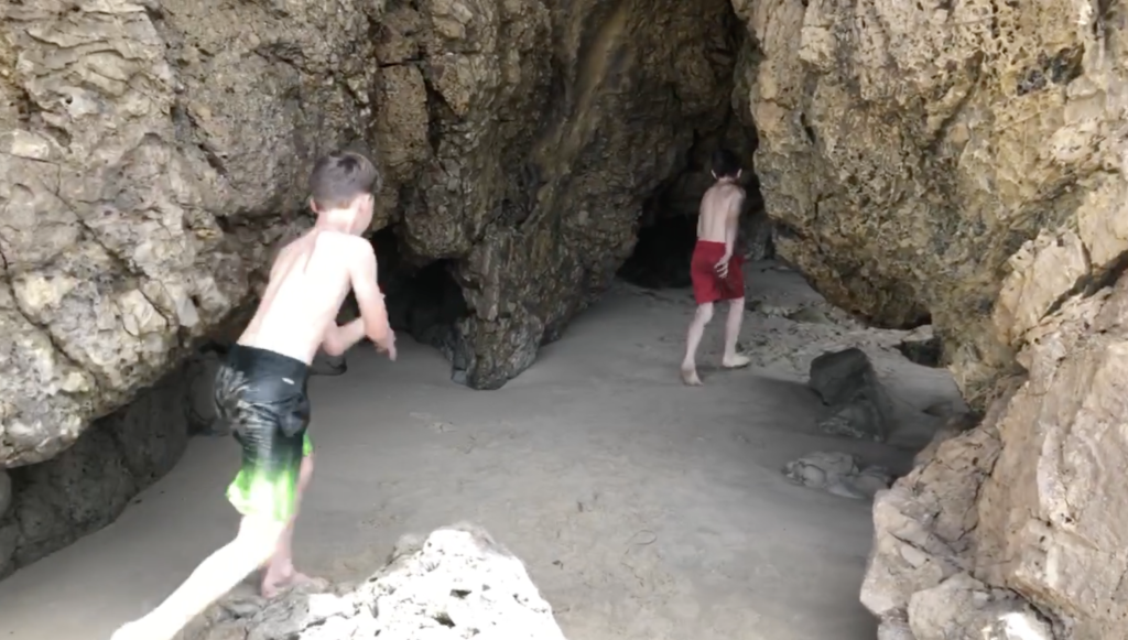 boys in cave near newport dunes