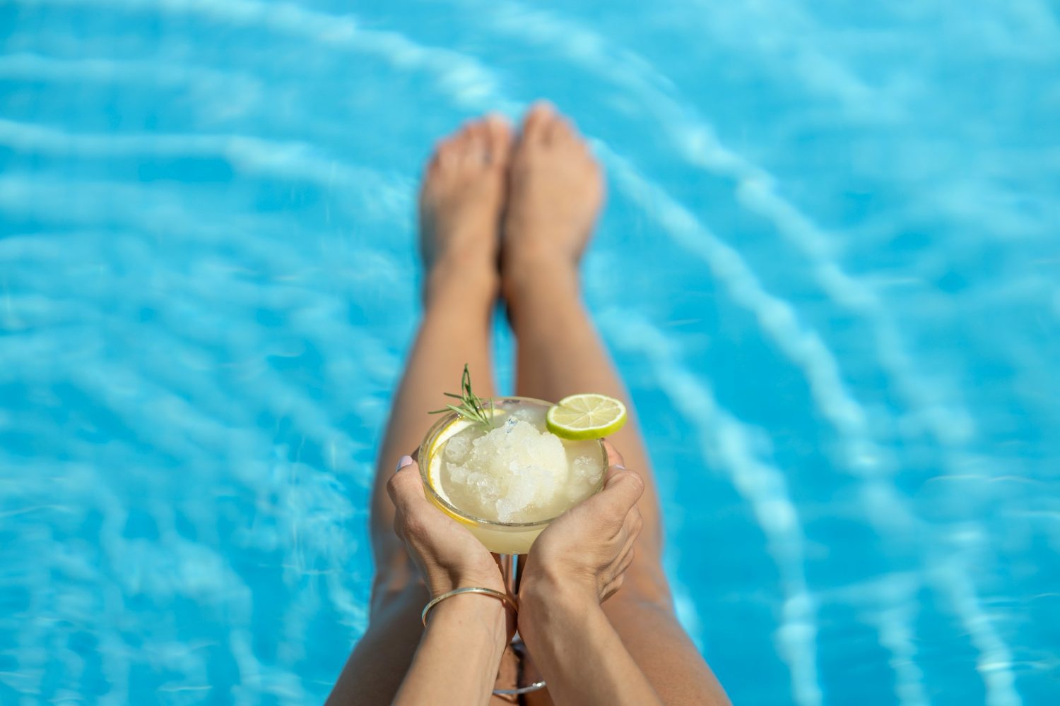 Alcoholic drink being enjoyed in pool. Best Turks and Caicos family resorts.