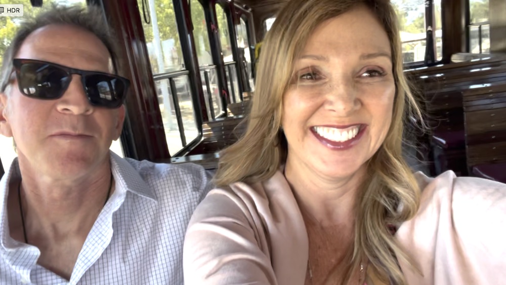 couple all smiles in empty wine trolley