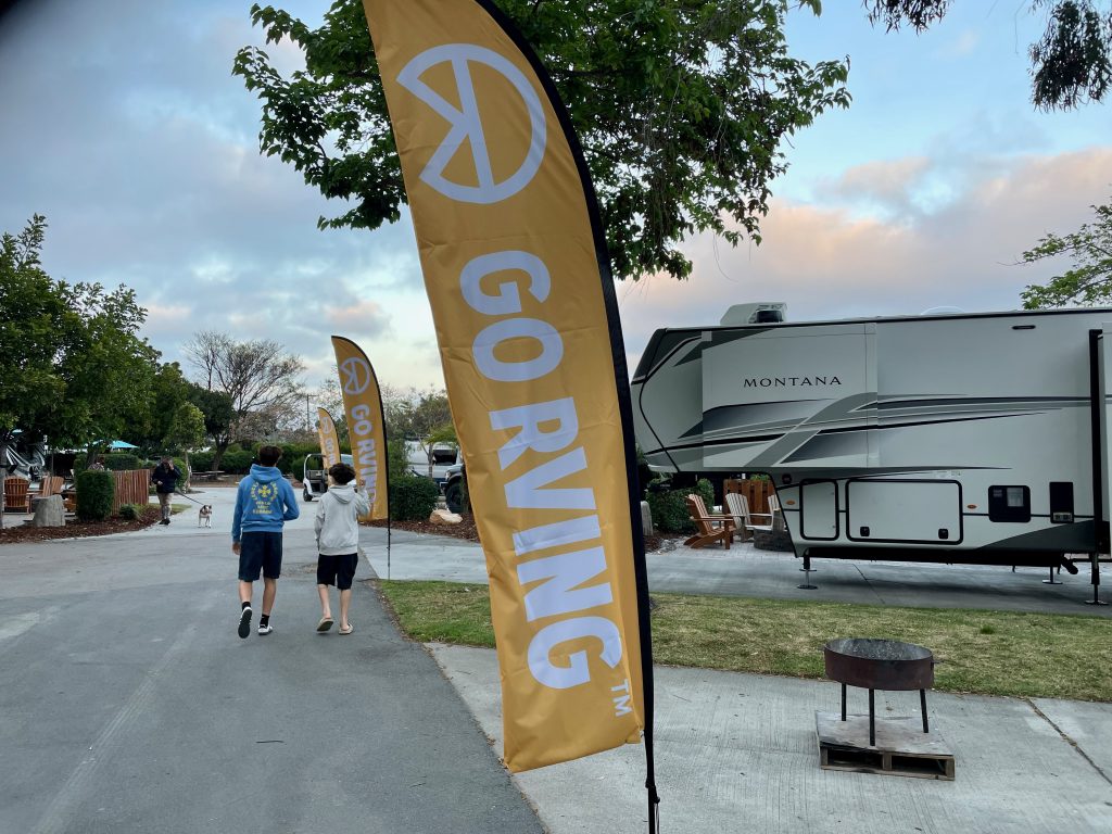 GoRVing.com sign with two boys - lightweight travel trailer