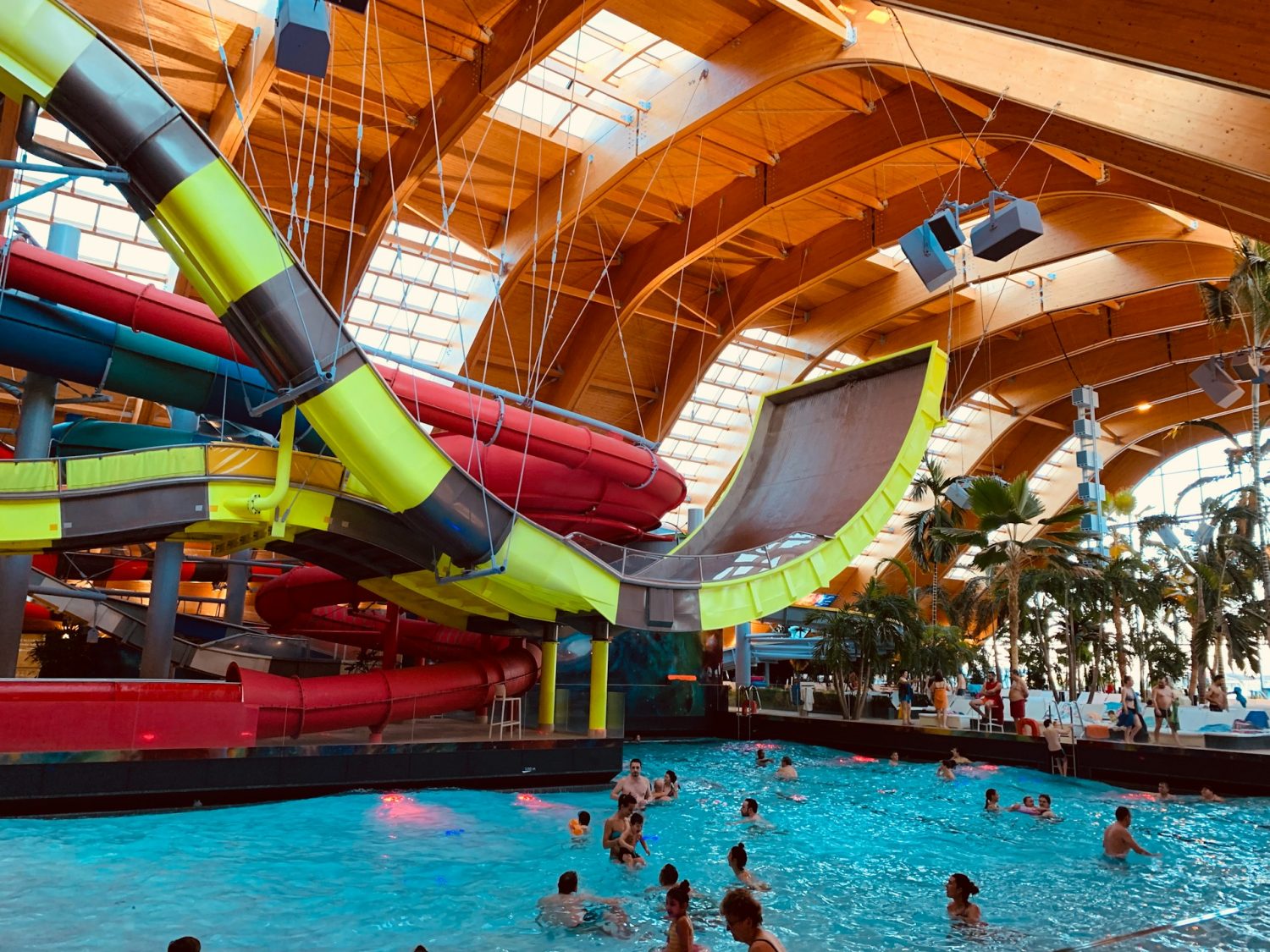 Photo by Toa Heftiba on Unsplash. Hotels with indoor waterparks.