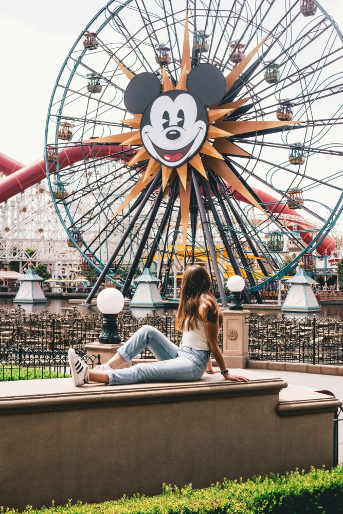 Mickey Ferris Wheel with girl relaxing in front