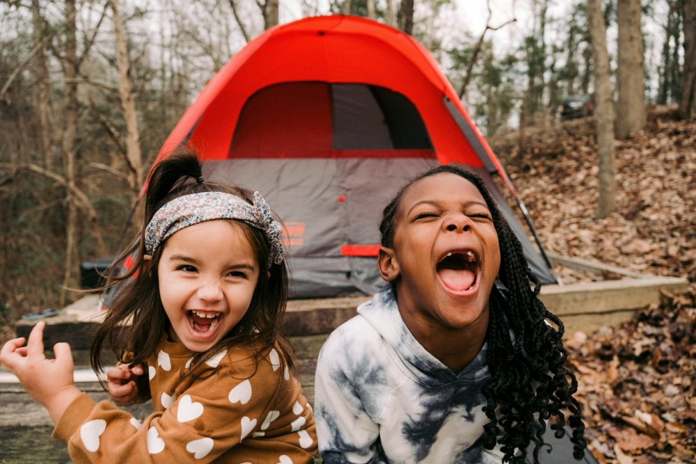 two girls making faces - best family campgrounds, family travel