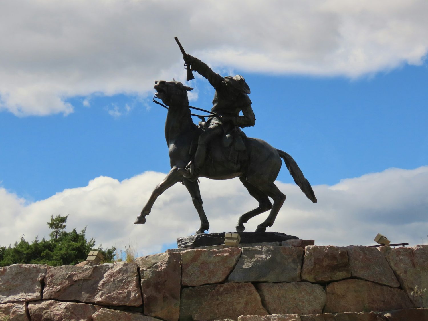 Buffalo Bill statue. Family horseback riding vacations.